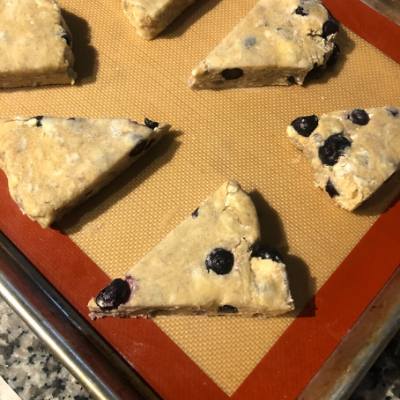 Blueberry Scones Spaced Out on Baking Tray